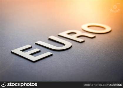 Word euro written with white solid letters on a board. Word euro written with white solid letters