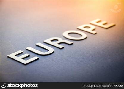 Word Europe written with white solid letters on a board. Word Europe written with white solid letters