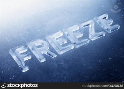 "Word "Freeze" made of real ice letters on ice background."
