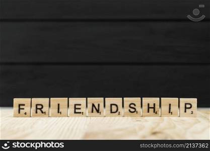 word friendship spelt with wooden letters