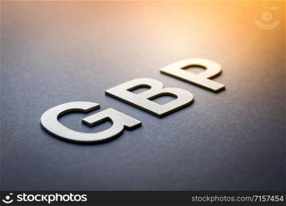 Word GBP written with white solid letters on a board. Word GBP written with white solid letters