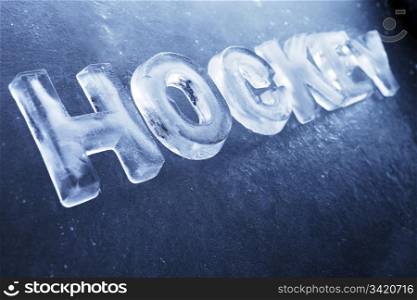 "Word "Hockey" made of real ice letters on ice background."