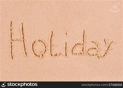 word holiday in the wet sand