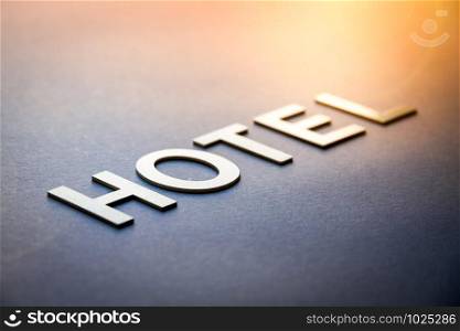 Word hotel written with white solid letters on a board. Word hotel written with white solid letters