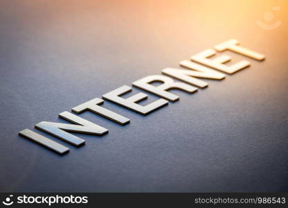 Word internet written with white solid letters on a board. Word internet written with white solid letters