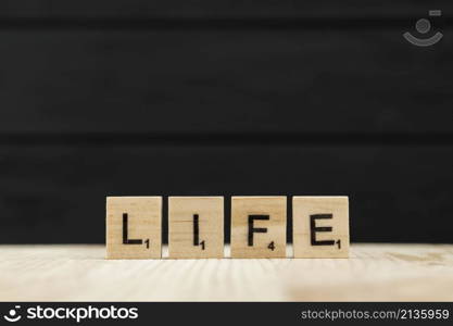 word life spelt with wooden letters