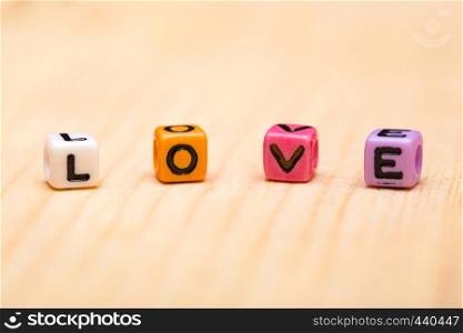 word love from cubes on a wooden desk