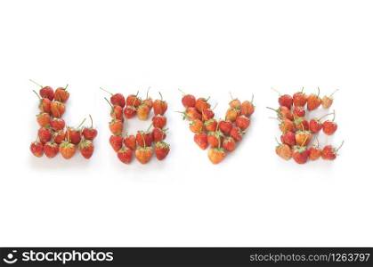"word " LOVE" made from strawberries on white background for design. Card and t-shirt design."