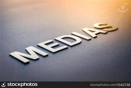 Word medias written with white solid letters on a board. Word medias written with white solid letters