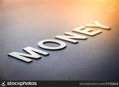 Word money written with white solid letters on a board. Word money written with white solid letters