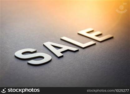 Word sale written with white solid letters on a board. Word sale written with white solid letters