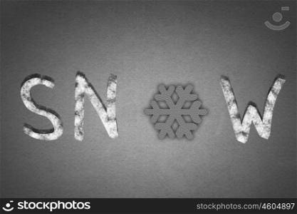 Word snow. Word snow on concrete background with snowflake instead of letter O