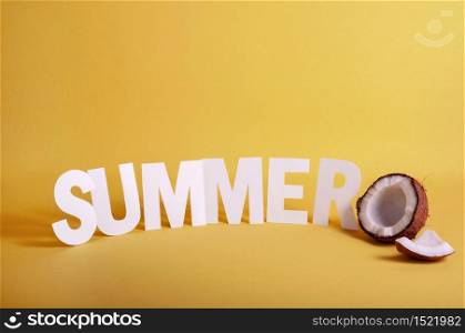 Word SUMMER made White Paper Letters with Half Coconut on Yellow Background. Copy Space For Your Text.. Word SUMMER made White Paper Letters with Half Coconut on Yellow Background. Copy Space For Your Text