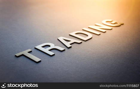Word trading written with white solid letters on a board. Word trading written with white solid letters