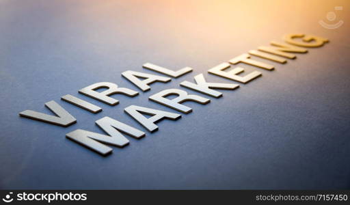 Word viral marketing written with white solid letters on a board. Word viral marketing written with white solid letters