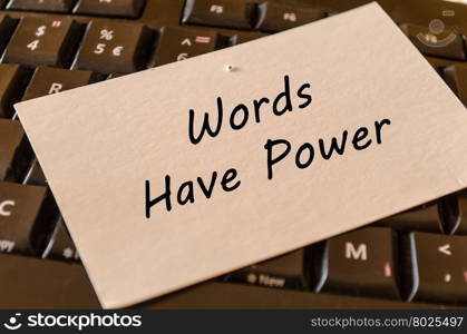 Words have power concept on black keyboard background