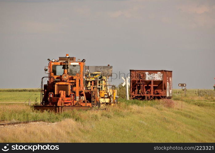 Work and ore rail cars parked on unused railroad tracks