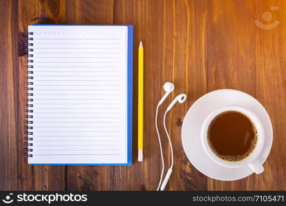 Work desk with notebook and coffee cup