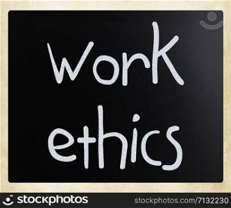 ""Work Ethics" handwritten with white chalk on a blackboard"