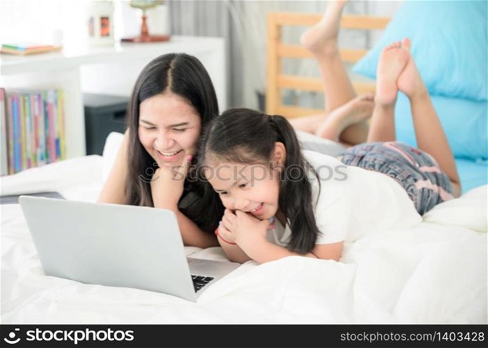 work from home, 2 sisters are working on laptop at home
