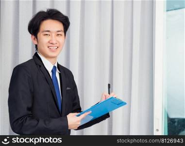 Work from home, Asian young businessman video conference call or facetime he smiling write notebook information at the home office