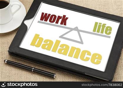 work life balance concept on a digital tablet with a cup of coffee