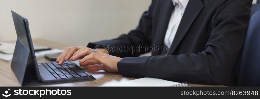 Work of secretary concept, Female secretary is working and typing report of business on tablet.