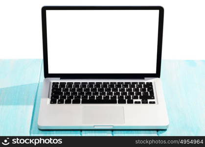 Work on the go. Modern laptop computer on blue wooden table against white background