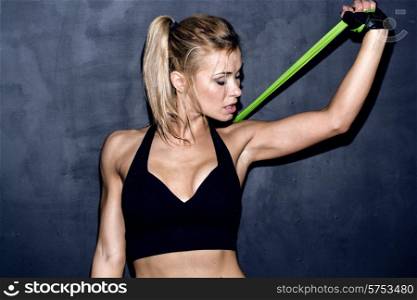 work out with rubber band, female caucasian model, trained body