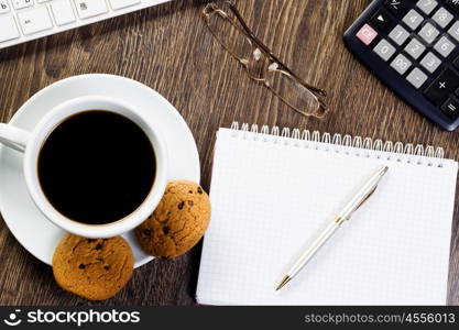 Work place. Business work place with cup of coffee calculator and glasses