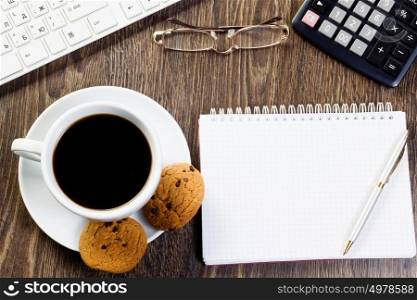 Work place. Business work place with cup of coffee calculator and glasses