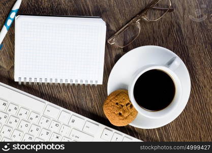 Work place. Business work place with cup of coffee calculator and glasses