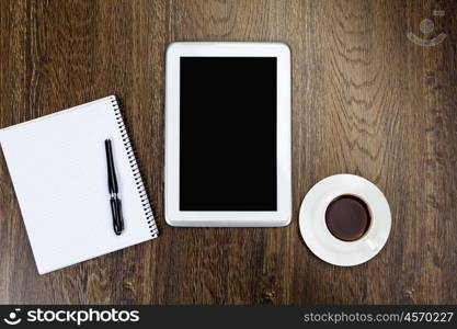 Work place. Tablet pc cup of coffee and keyboard at table