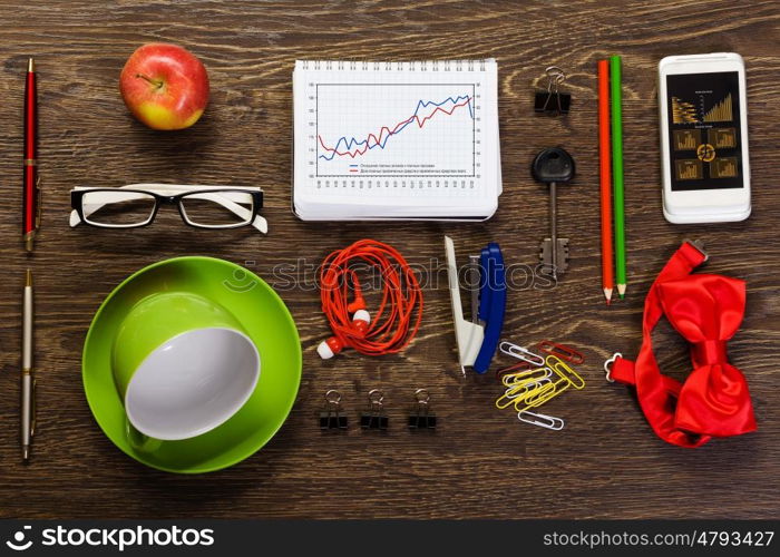 Work place. Tablet pc mobile phone and stationary items on wooden table