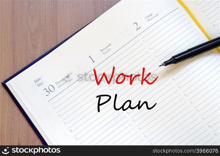 Work plan text concept write on notebook