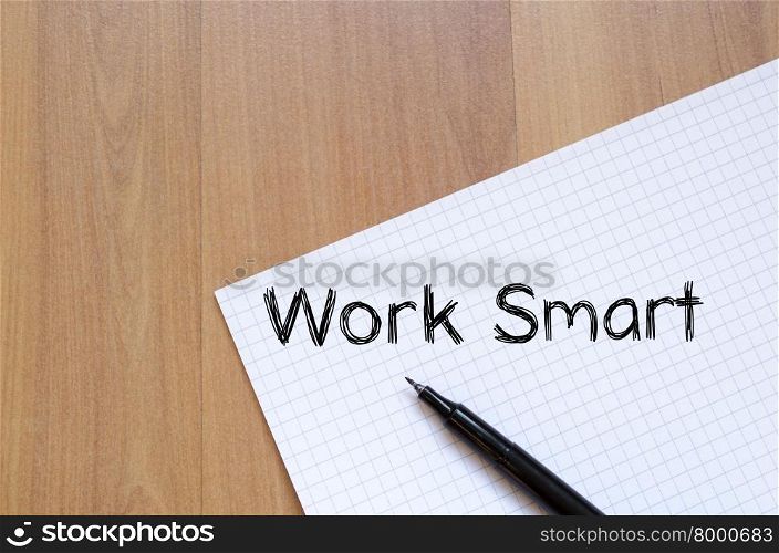 Work smart text concept write on notebook with pen