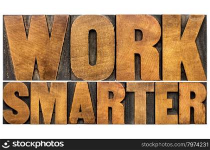 work smarter word abstract - motivational advice or reminder - isolated text in letterpress wood type printing blocks