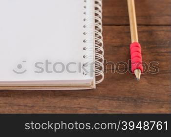 Work station with notebook and pencil, stock photo