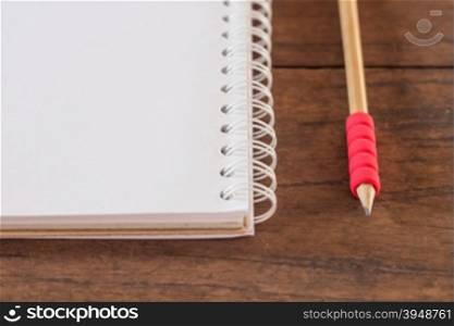 Work station with notebook and pencil, stock photo