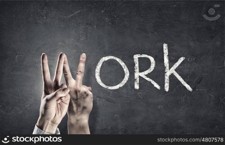 Work word. Conceptual image with word work and fingers instead of letter
