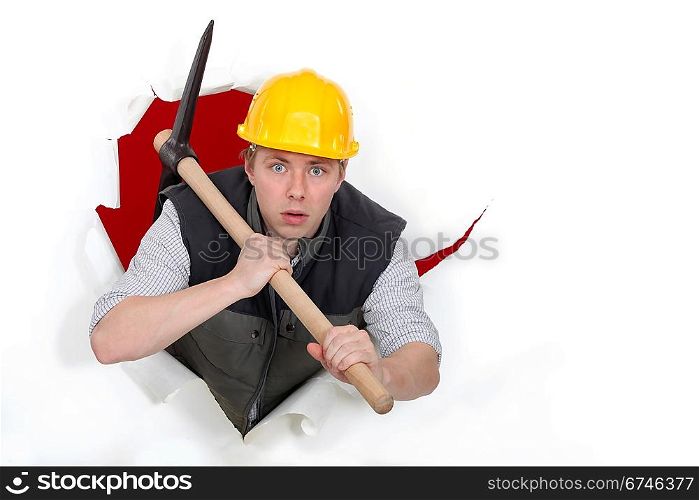 Worker bursting through with a pickaxe