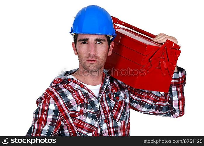 Worker carrying a toolbox
