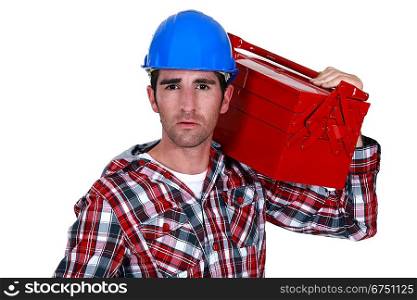 Worker carrying a toolbox
