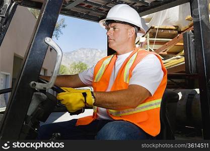 Worker Driving a Forklift
