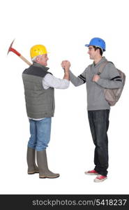 Worker greeting apprentice