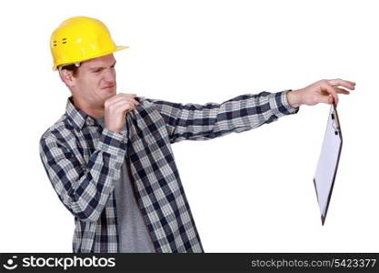 Worker holding a distasteful clipboard