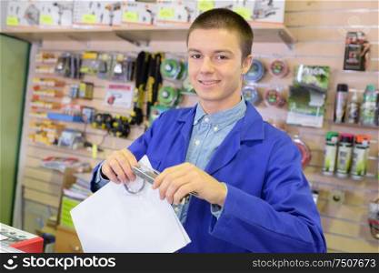 worker holding a piece of paper