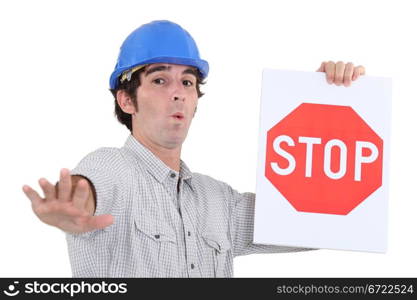 Worker holding a red stop sign