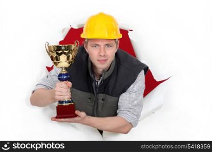 Worker holding a trophy cup.