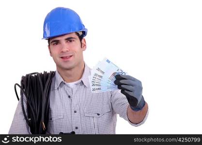 Worker holding bunch of bank notes
